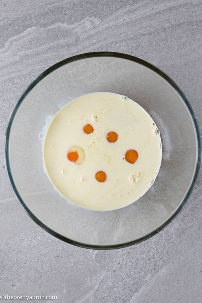 Eggs and cream in glass bowl