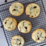 six chocolate chip cookies made with white sugar cooling on wire rack