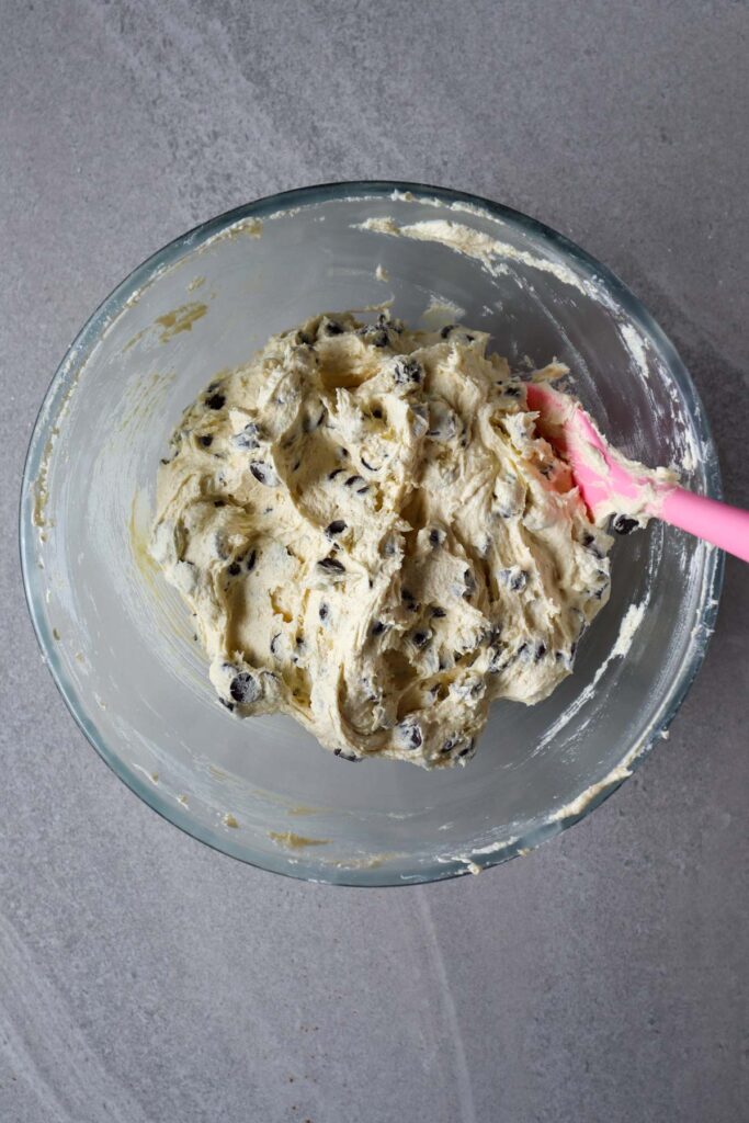 chocolate chip cookie dough made with only white sugar in glass bowl