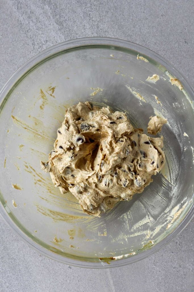 chocolate chip cookie dough with molaases in glass bowl