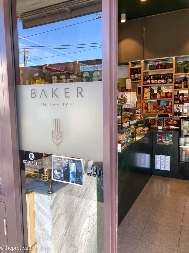 Baker in the Rye bakery store photo of door and bread in background