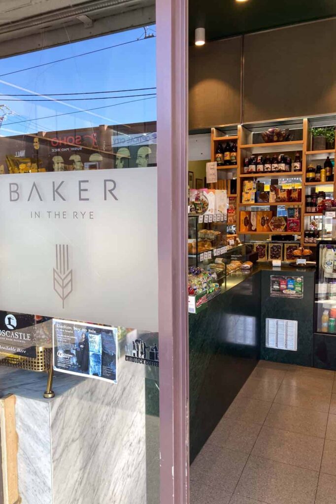Baker in the Rye bakery store photo of door and bread in background