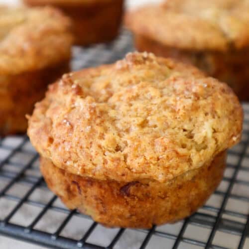 Five Banana cottage cheese muffins on cooling rack