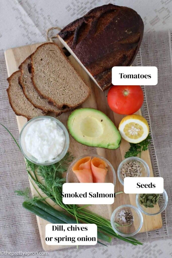 additional toppings of tomatoes, smoked salmon and seeds