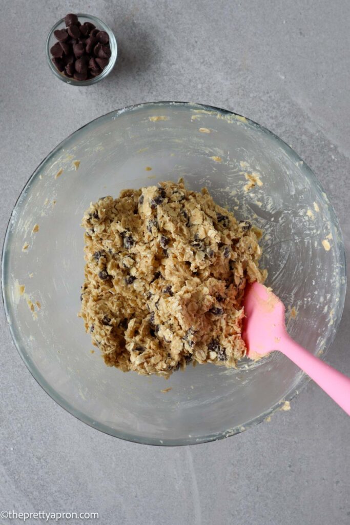 Oat chocolate chip cookie cookie dough in glass bowl