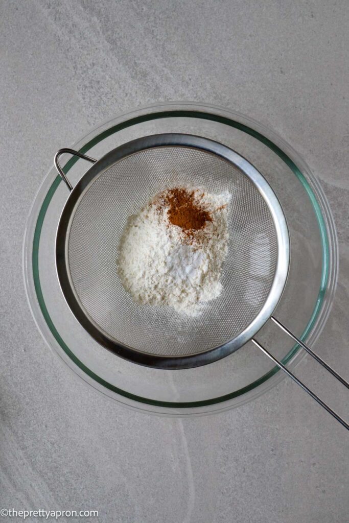 sift flour, cinnamon, baking soda and salt together in glass bowl
