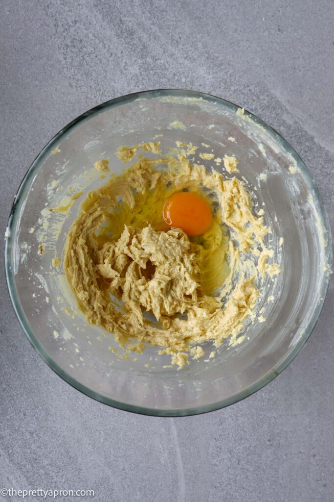 beat in egg into creamed butter and white sugar