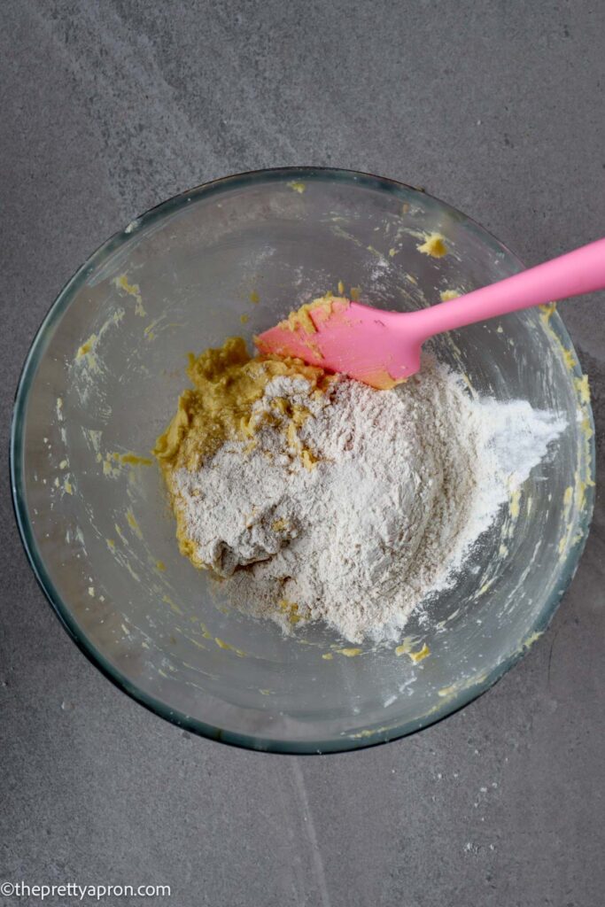 added flour mixture to beaten butter, sugar and egg mixture in glass bowl
