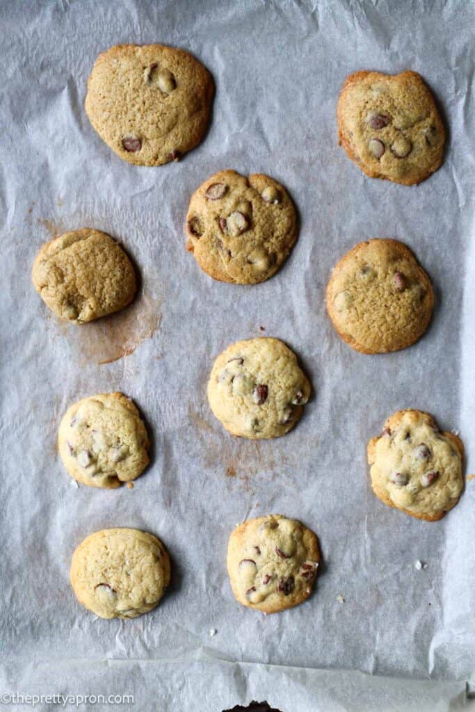 baking tray with 6 darker chocolate chip cookies and 6 lighter cookies