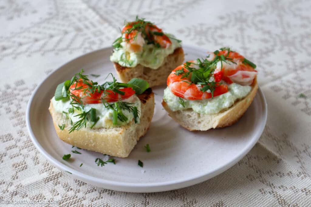 three pieces of avocado toast on plate