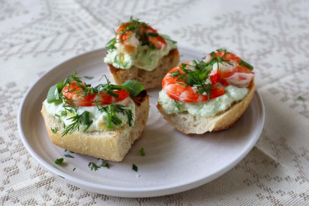 three pieces of avocado toast on plate
