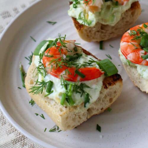 three pieces of avocado shrimp toast on plate