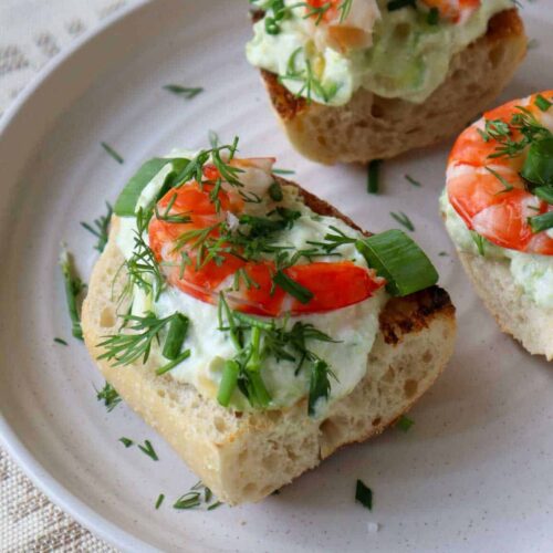 three pieces of avocado shrimp toast on plate