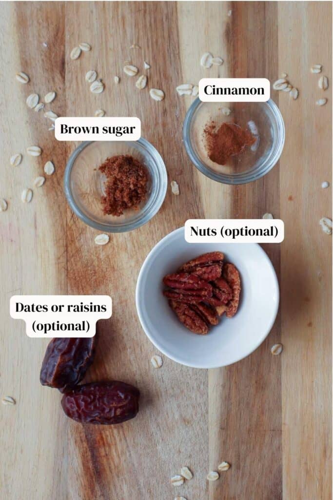Cinnamon, brown sugar, pecans in little bowls and dates on a wooden board.