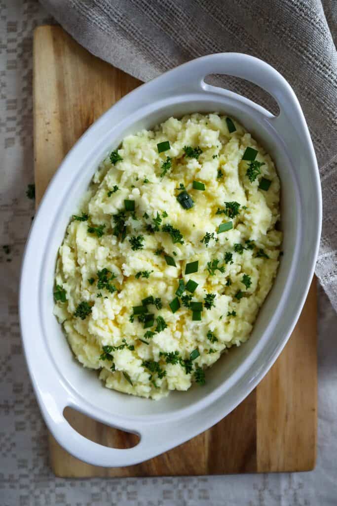 Mashed potatoes with cottage cheese, butter and fresh herbs.