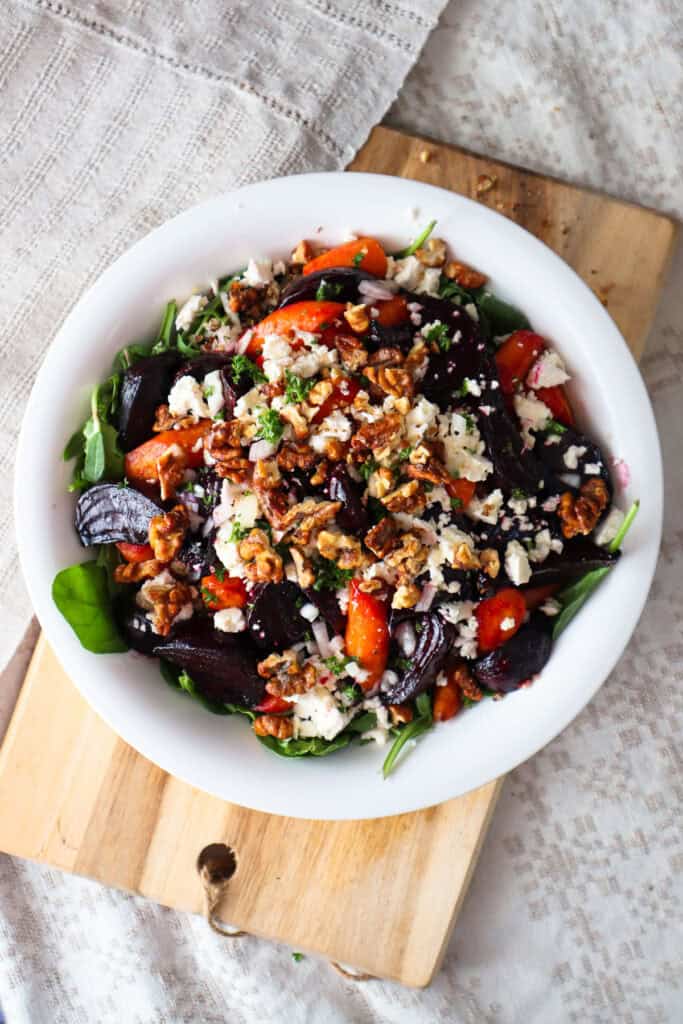 Roasted beets and carrots on bed of arugula and baby spinach and topped with feta and toasted walnuts.