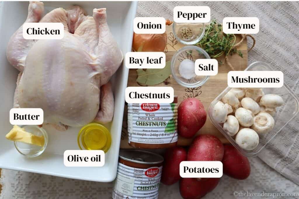 Fresh raw chicken with labeled ingredients including pepper, salt, thyme, mushrooms, potatoes, onion, bay leaf and chestnuts in a can.