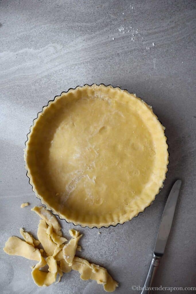 pate brisee pie crust prepared and ready to be put in the freezer.