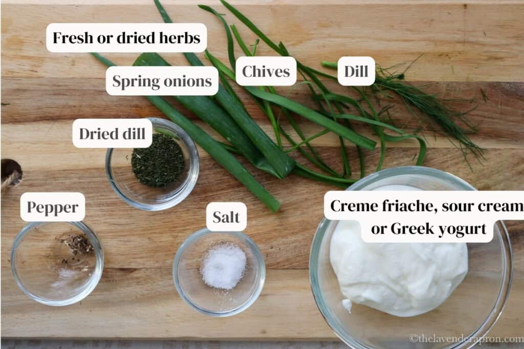 Ingredients for a creamy topping to put on the salmon and spinach quiche, including creme fraiche and herbs.