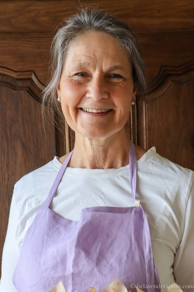 Marissa wearing a lavender apron.