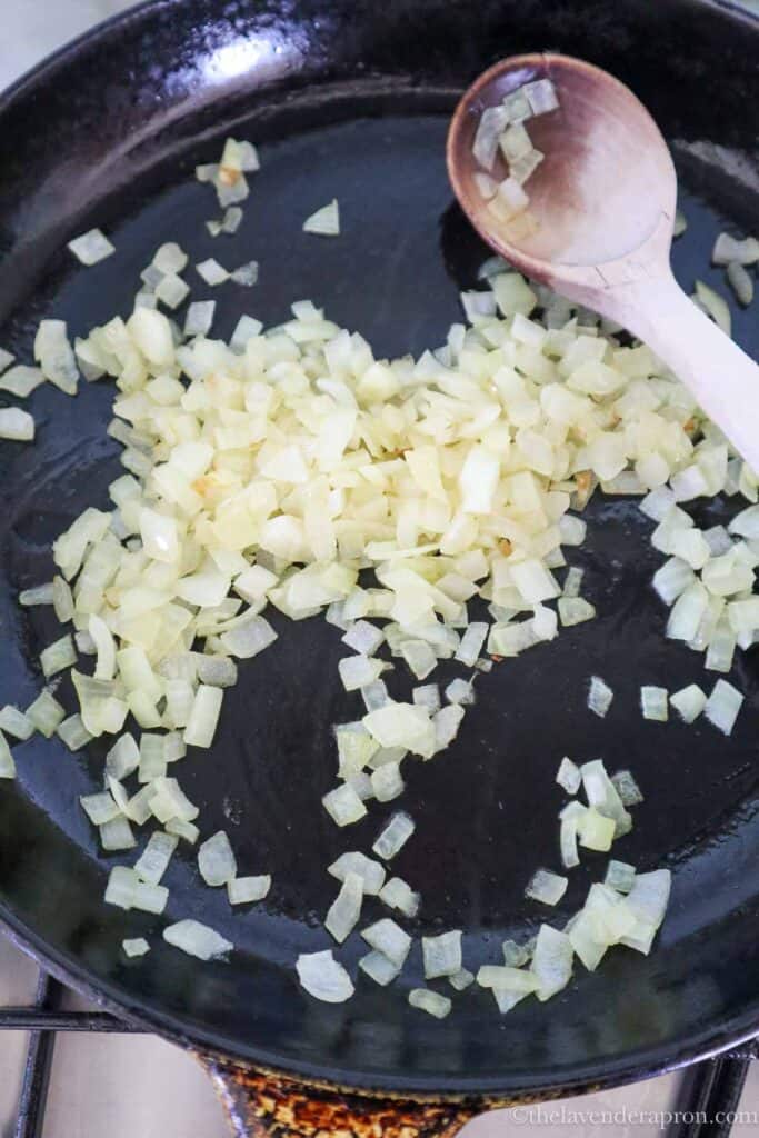 Sauté finely diced onion in pan with butter.