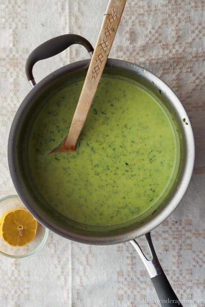 Blended zucchini, onions and garlic with water in a pot.