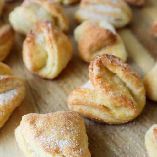 Close up of Latvian cottage cheese cookies on wooden board.