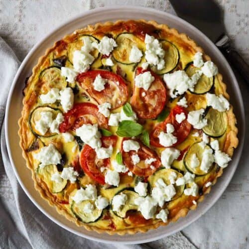 Quiche provencale topped with goat's cheese.