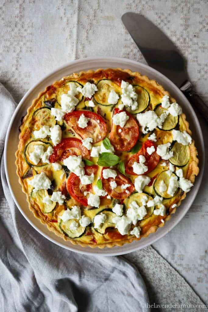 Quiche provencale topped with goat's cheese.