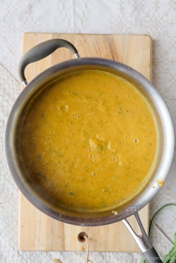 Pureed broccoli and sweet potato soup in a pot.