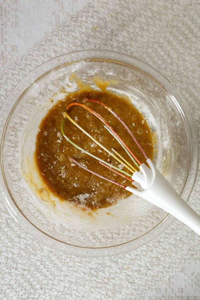 Adding dry ingredients to the wet ingredients until just combined.