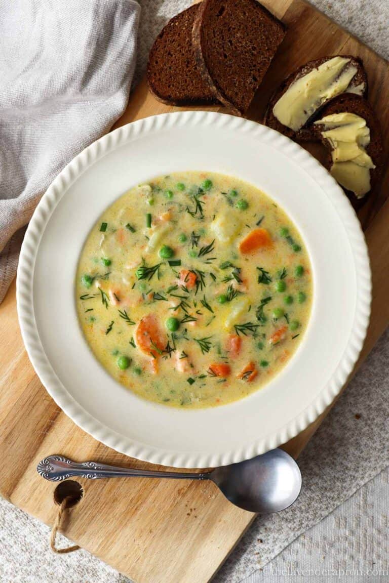 Creamy salmon soup served with dark rye bread and butter.