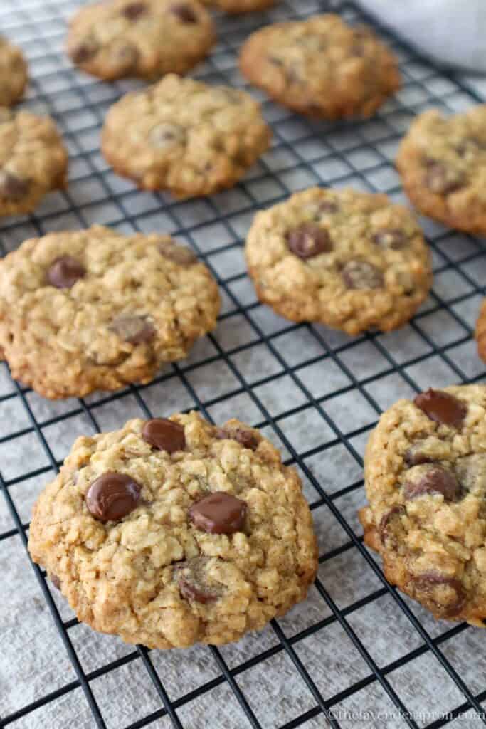Easy oatmeal chocolate chip cookies made with melted butter on a cooling rack