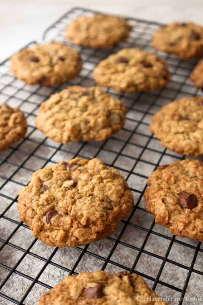 Easy oatmeal chocolate chip cookies cooling on a wire rack.