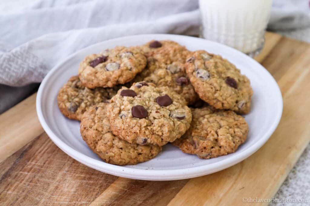 A plate of easy oatmeal chocolate chip cookies on wooden board ready to be served.
